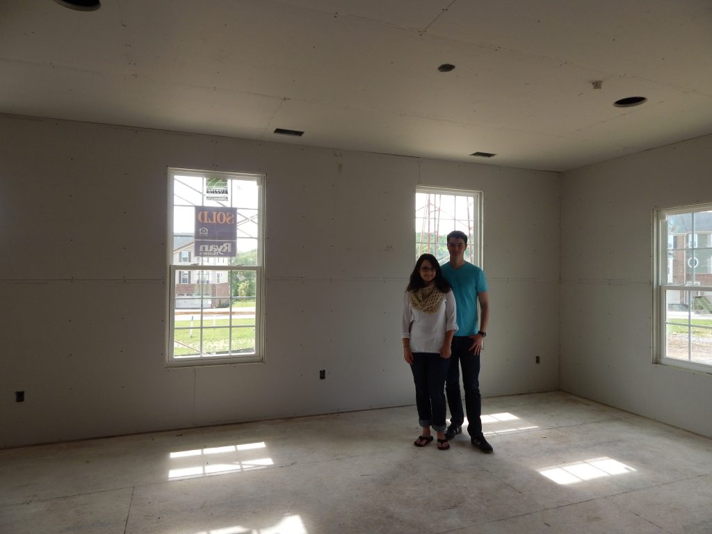 Christene and Ben in Living Room Drywall Construction