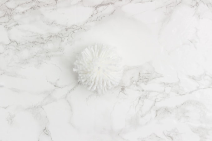 Make the perfect pom poms using this easy to use tool! I love pom poms in modern home decor. They are so trendy right now and super playful!