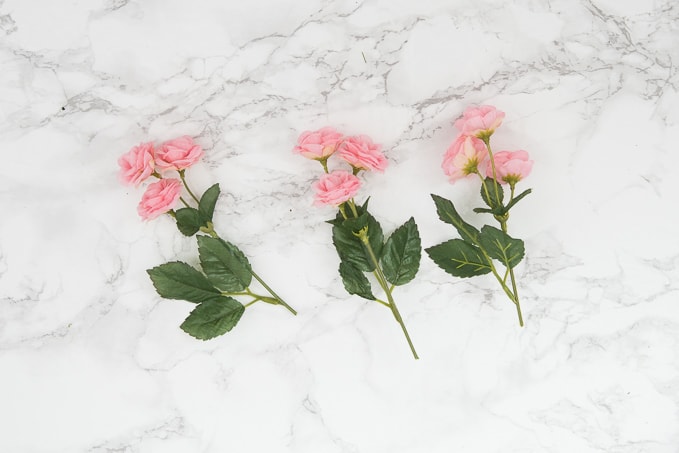 Pretty idea and unique take on a spring wreath! This geometric floral door hanger is gorgeous and a budget friendly way to create a unique spring decoration.