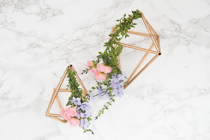 Pretty idea and unique take on a spring wreath! This geometric floral door hanger is gorgeous and a budget friendly way to create a unique spring decoration.