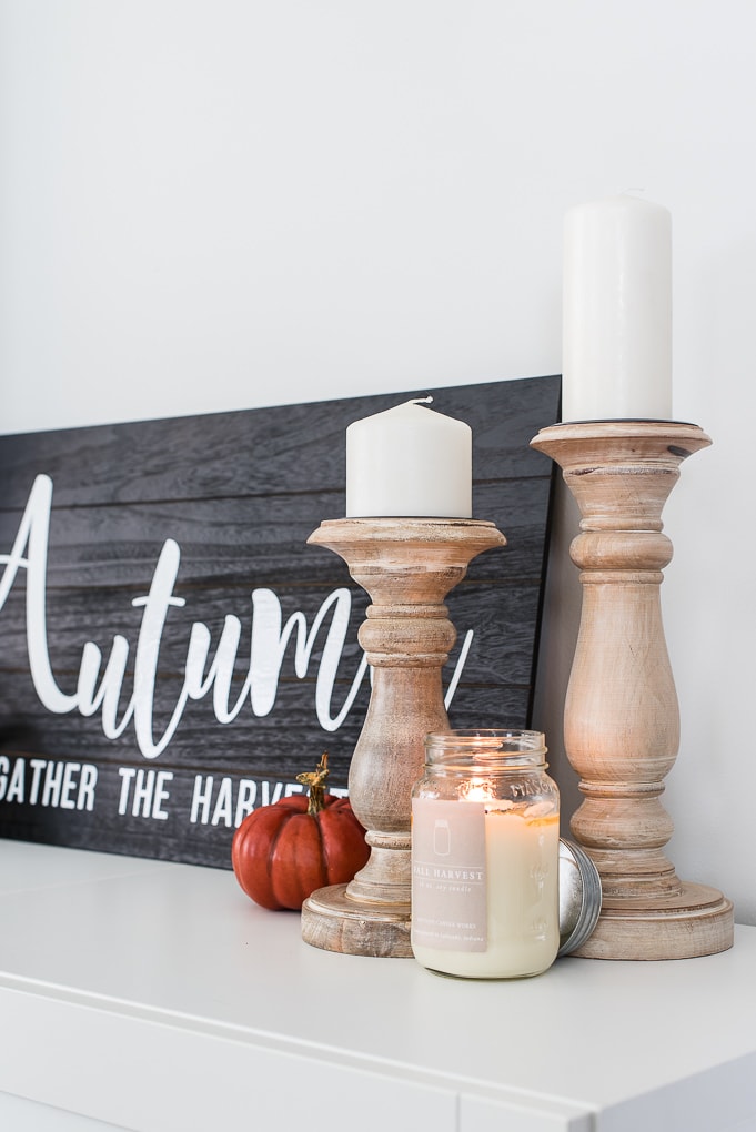 natural wooden candle holders and a fall harvest candle from antique candle works