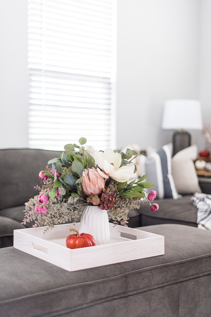 fall floral arrangement on a tray living room