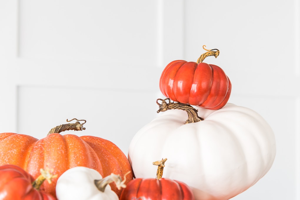 stacked orange and white pumpkins close up