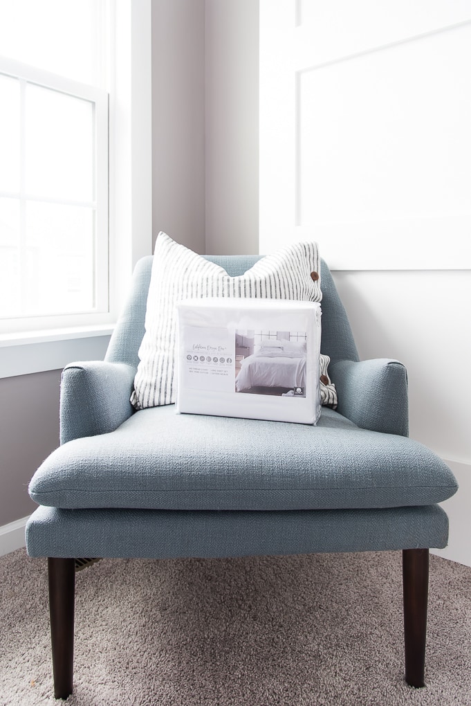 California Design Den Sheets set on a blue chair