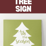 A green sign displays a white silhouette of a Christmas tree with "tis the season" in festive text. Set against a maroon backdrop with "'Tis The Season Tree Sign" at the top, it features a website URL and Cricut logo at the bottom.