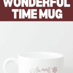 White mug adorned with shimmering gold snowflakes, featuring the festive text "Most Wonderful Time of the Year Mug." The background reads: "DIY Most Wonderful Time Mug," capturing the spirit of joy and celebration.