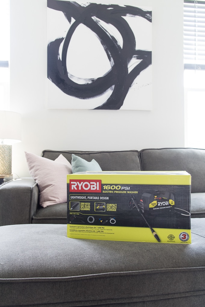 Ryobi power washer in box in living room