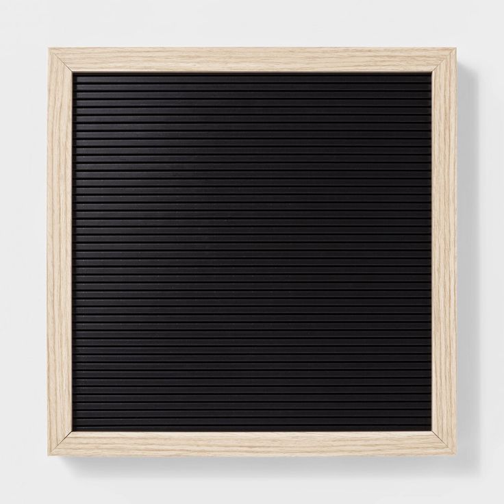 black blank letter board with light wood frame