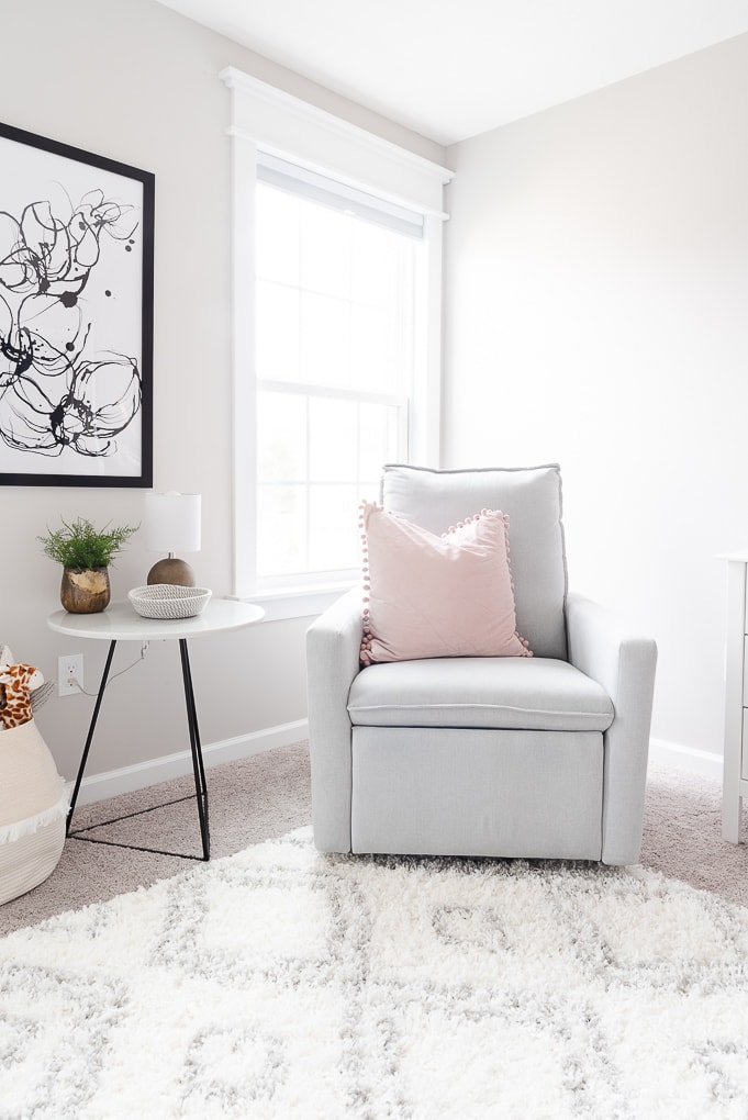 paxton glider chair in gray in a nursery