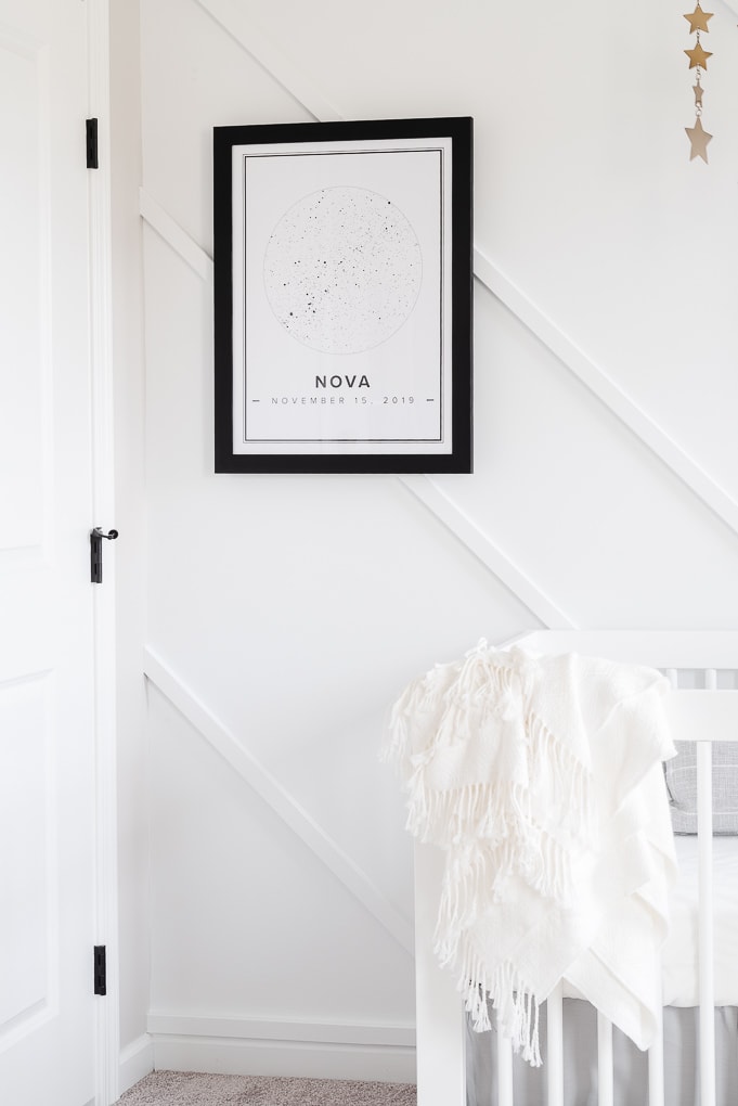 black and white star print from Mapiful framed on a modern accent wall in a neutral nursery