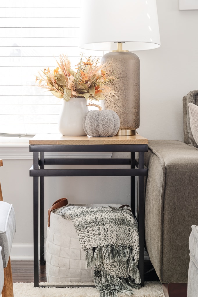 fall decor living room end table with basket and throw blanket