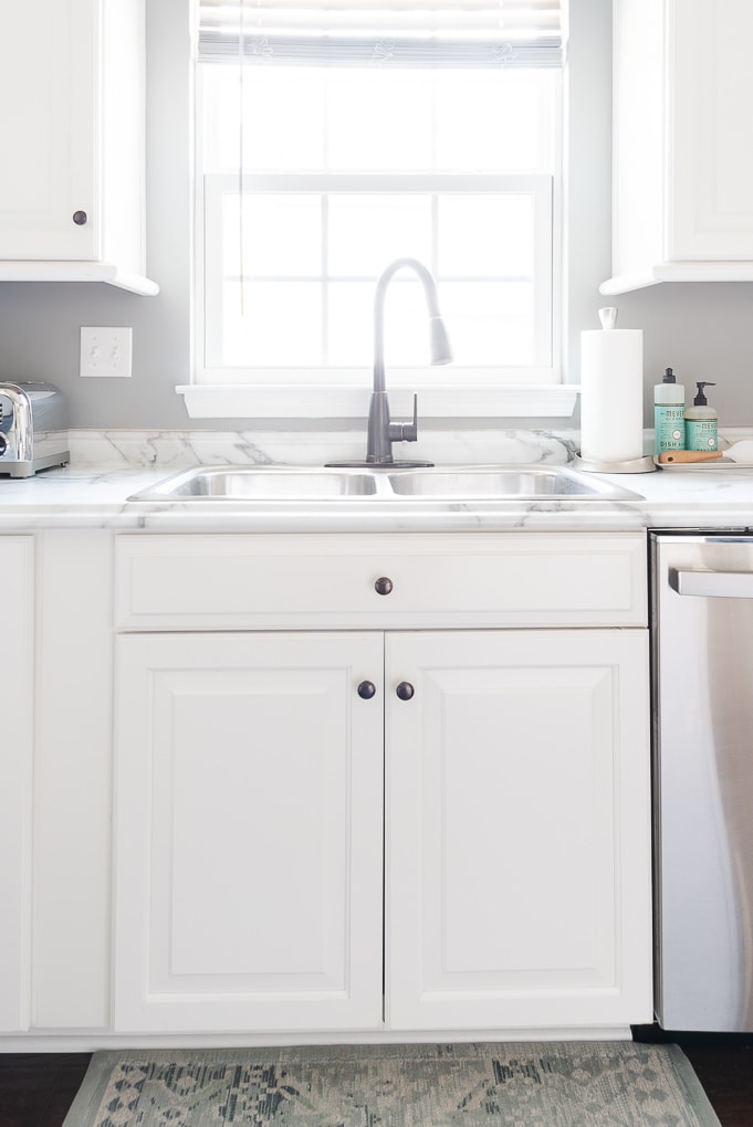 white kitchen sink and counter