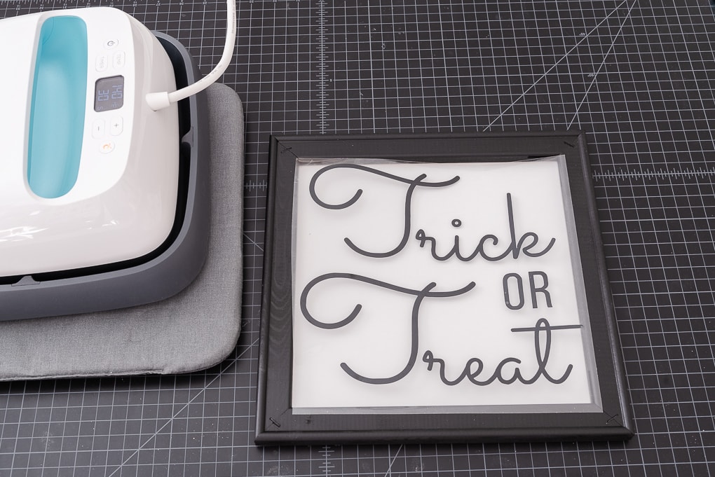 trick or treat vinyl design on top of white canvas