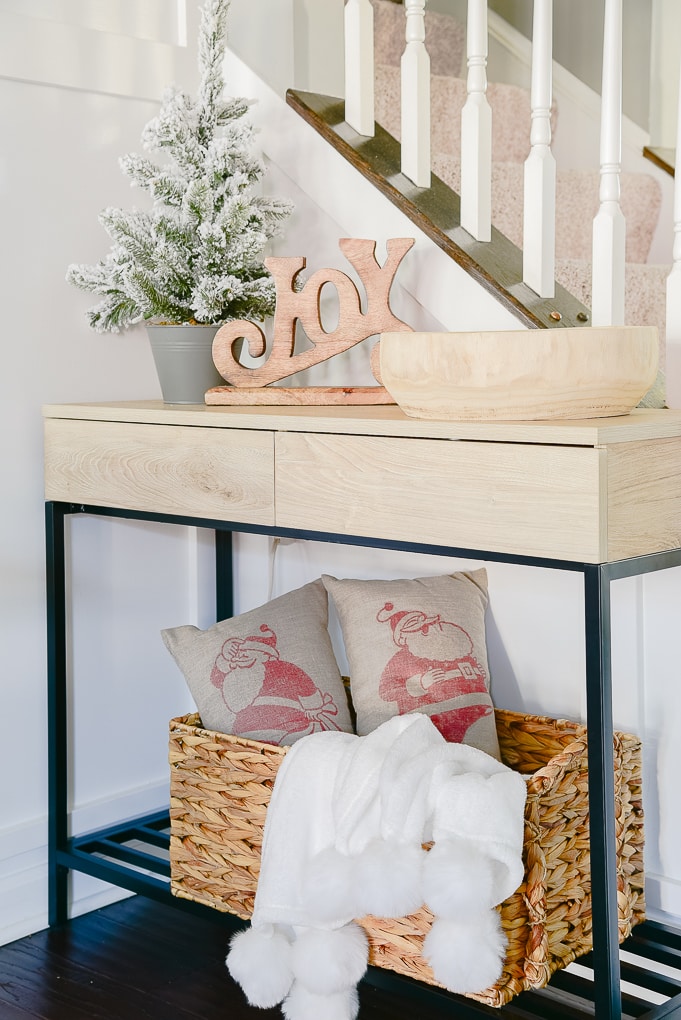 modern console table with Christmas decor styled on top