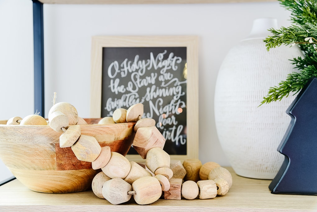 Studio McGee wooden garland from target in wooden bowl on shelf