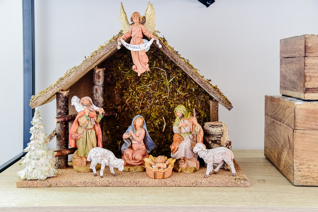 traditional nativity scene on shelf in living room