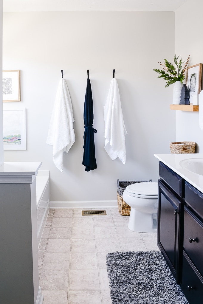 white towels and robe hanging in master bathroom christmas