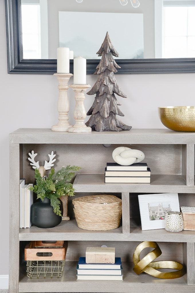 gray bookshelves decorated and styled for Christmas