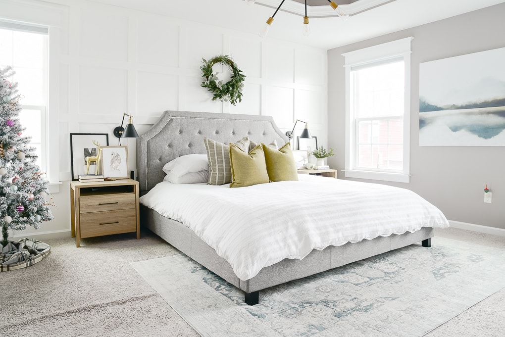 modern natural master bedroom decorated for Christmas