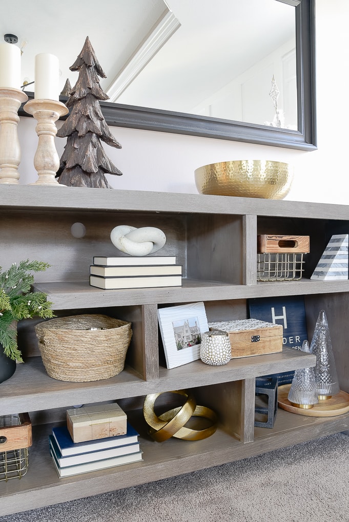 gray bookshelves decorated and styled for Christmas