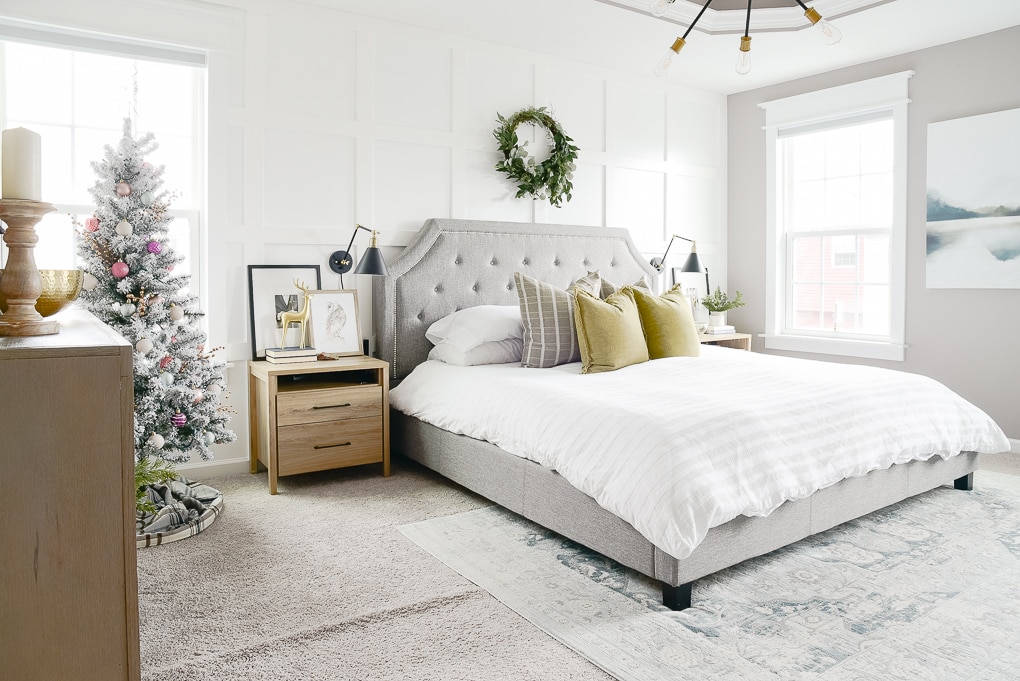 christmas master bedroom decorated with flocked christmas tree