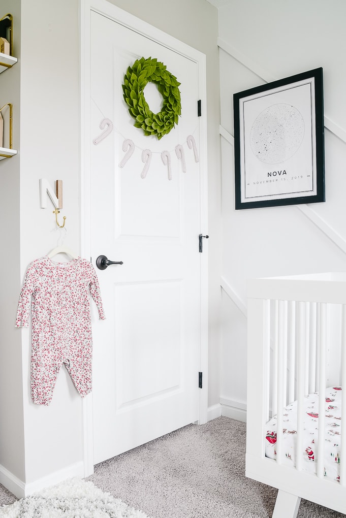 nursery closet door decorated for Christmas with a wreath and garland