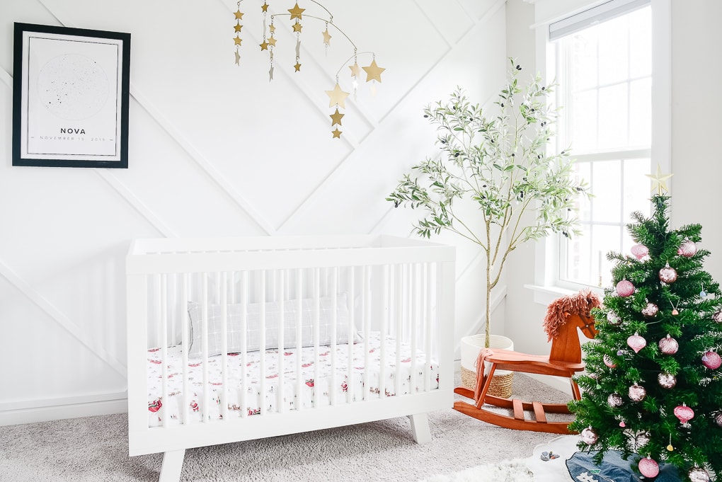 white nursery decorated with a kids tree for Christmas