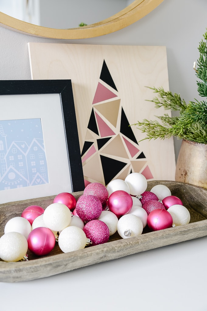 pink and white ornaments in a tray christmas decor