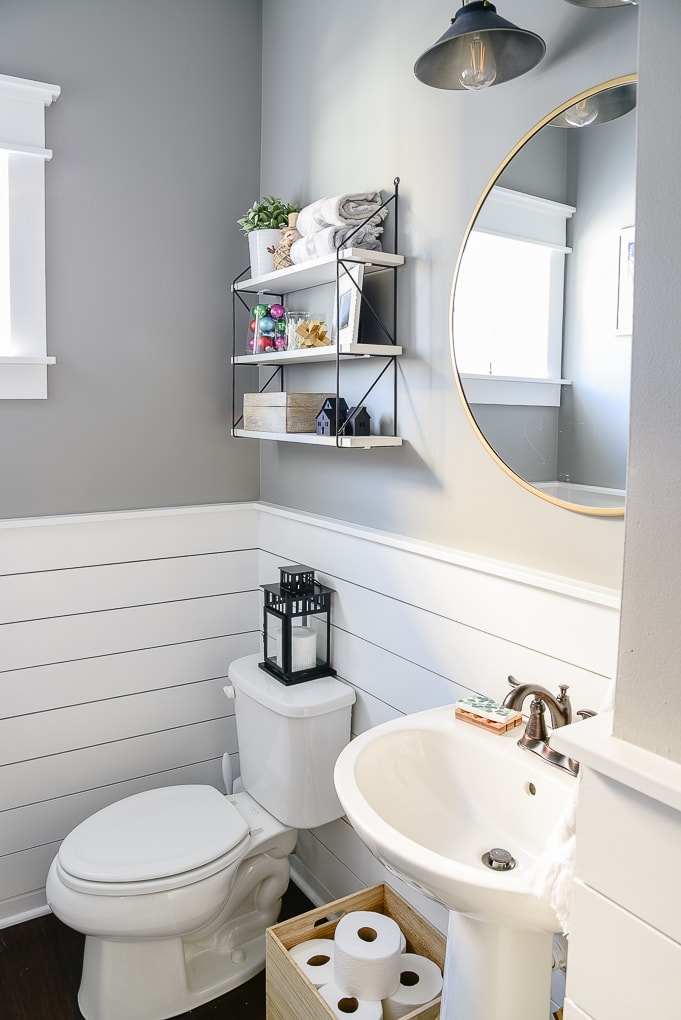 simple clean powder room with shiplap decorated for Christmas