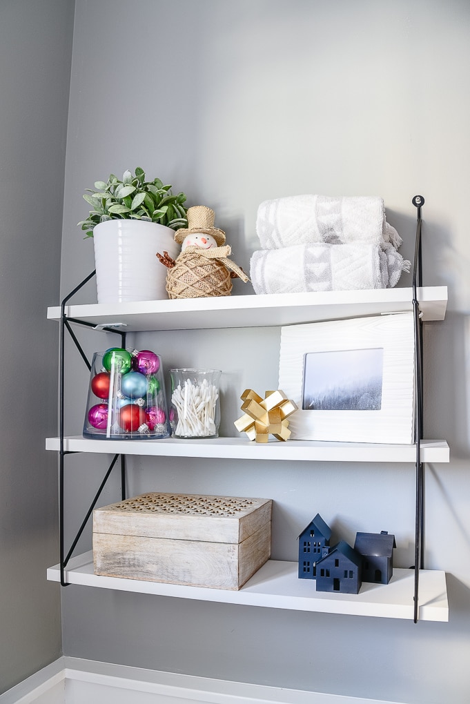 styled decorated shelves in powder room Christmas styling and decor