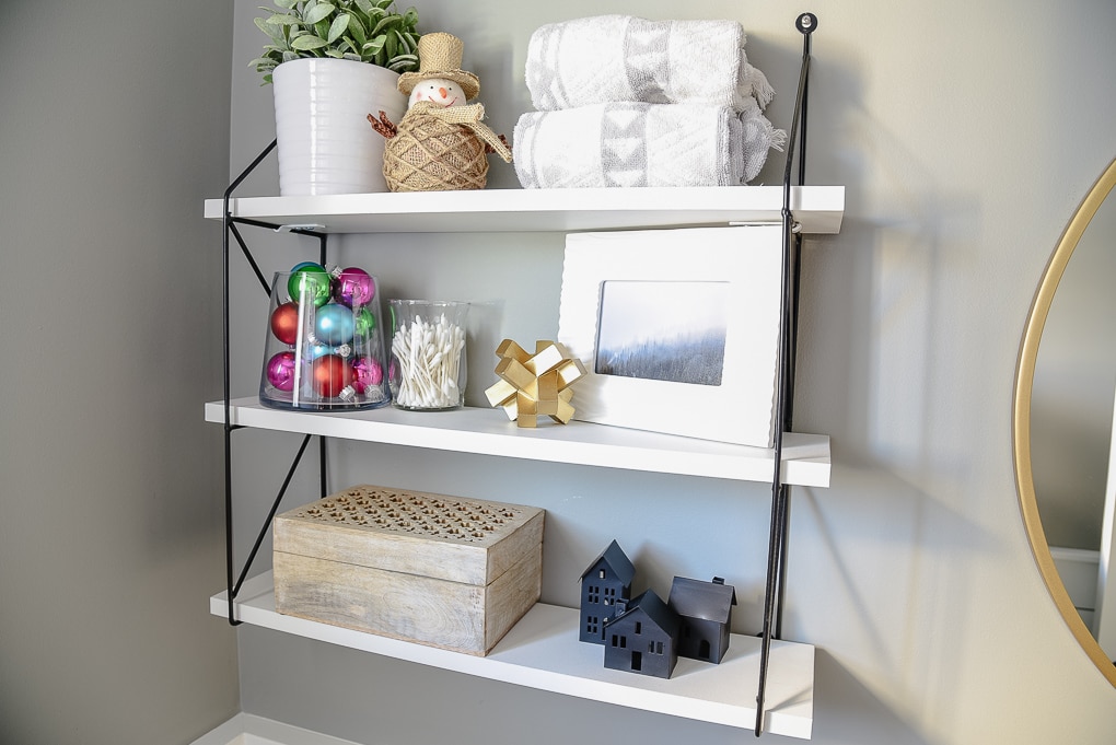 powder room styled shelves decorated for Christmas