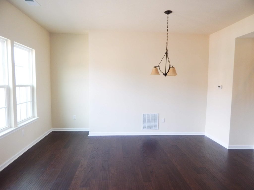 empty dining room in townhome with yellow paint on the walls