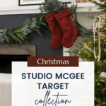 A cozy Christmas scene featuring a decorated fireplace with lush greenery and red stockings hanging. Nearby is a Christmas tree adorned with ornaments and lights. A sign reads "STUDIO MCGEE TARGET Christmas Collection" with a URL: CHRISTENEHOLDERHOME.COM.