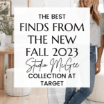 A woman with long hair smiles, standing next to a sign that reads: "The best finds from the new Fall 2023 Studio McGee Target Collection." The room features a cozy, modern style with a plant, a wooden table, a light-colored rug, and a white armchair.