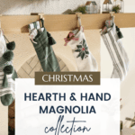 A cozy fireplace adorned with Christmas stockings and festive decorations from the Hearth and Hand with Magnolia Target Christmas Collection. The image features green and white stockings hanging on a wooden mantel. The text overlay reads "Christmas, Hearth & Hand Magnolia Collection" with a website URL.