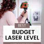 A person with curly hair stands in front of a photo wall using the best budget laser level on a tripod to perfectly align the frames. The image features text: "Best Budget Laser Level" and a website link, "CHRISTENEHOLDERHOME.COM". Green laser lines are visible on the wall.