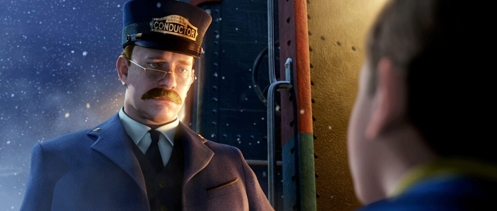 An animated movie scene, often hailed among the best Christmas movies for 4-year-olds, showcases a stern-looking train conductor in uniform, complete with a "Conductor" hat and round glasses. He stands by the train doorway under a soft, snowy night light, talking to a child whose back faces the viewer.