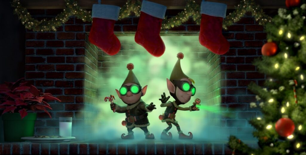 Two animated elves wearing green outfits and futuristic goggles stand in a fireplace surrounded by Christmas stockings and lights. One elf holds a candy cane, the other points forward. Nearby, a decorated Christmas tree sits next to a table with milk, cookies, and poinsettia—it's like a scene from the best Christmas movies for 4-year-olds.